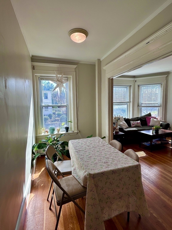 805 Washington Street, Unit 2 Brookline, MA 02446 - Photo 7 of 20 a living room with furniture and a table