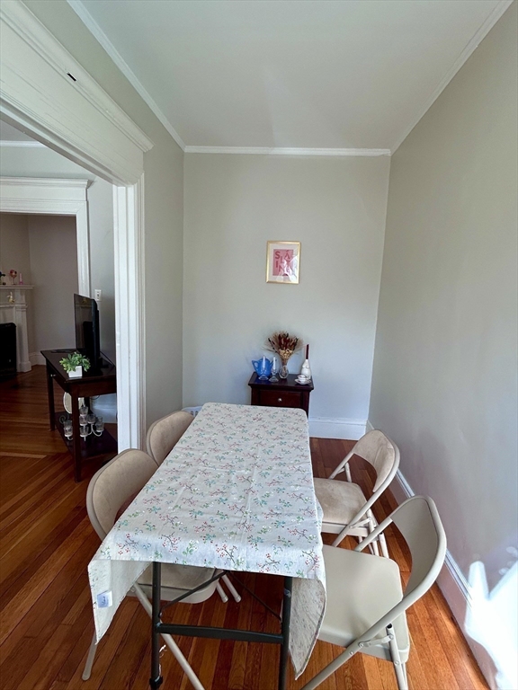 805 Washington Street, Unit 2 Brookline, MA 02446 - Photo 8 of 20 a dining room with a table and chairs