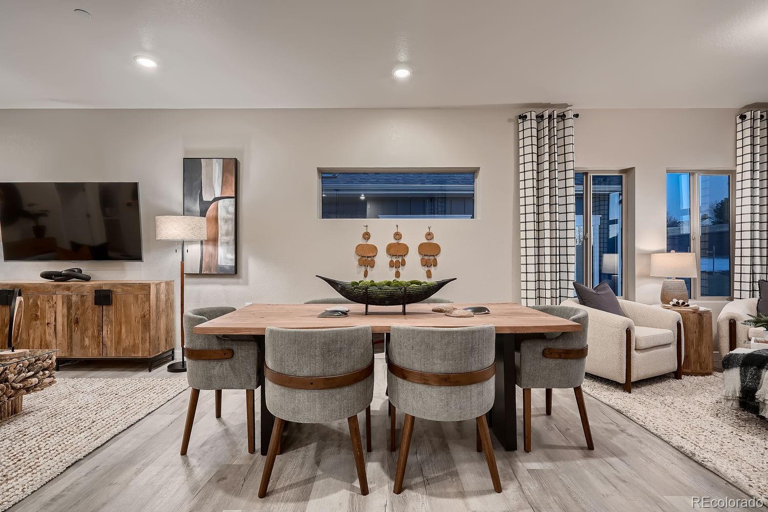 12880 Inca Street Westminster, CO 80234 - Photo 14 of 50 a dining room with furniture and wooden floor