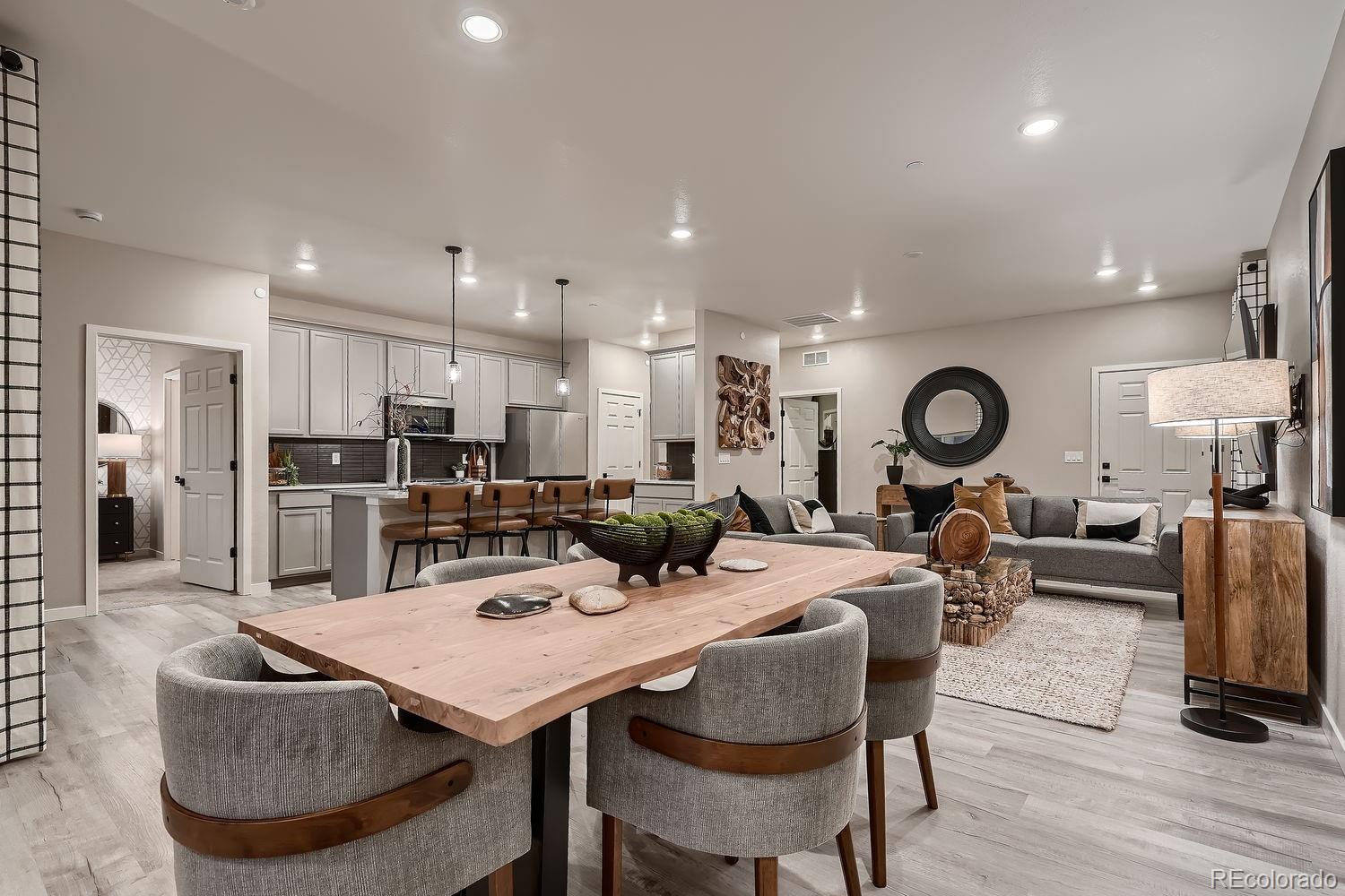 12880 Inca Street Westminster, CO 80234 - Photo 17 of 50 a living room with lots of furniture and kitchen view