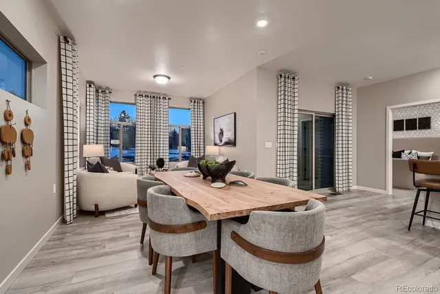 a view of a dining room with furniture and window