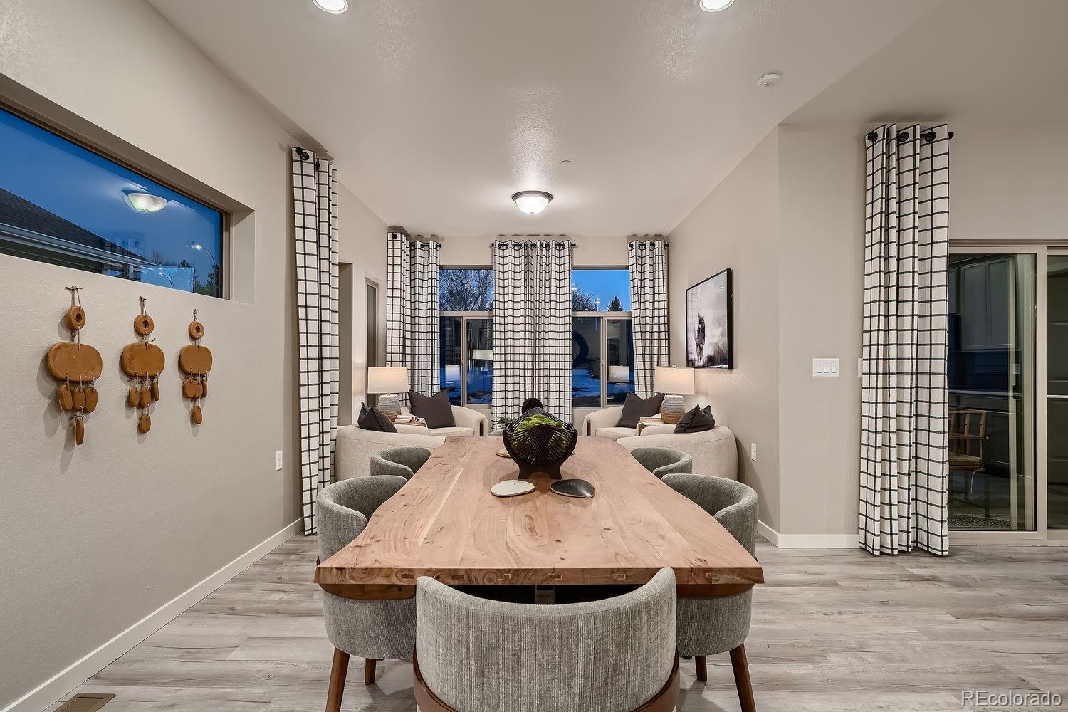 12880 Inca Street Westminster, CO 80234 - Photo 20 of 50 a view of a dining room with furniture and wooden floor