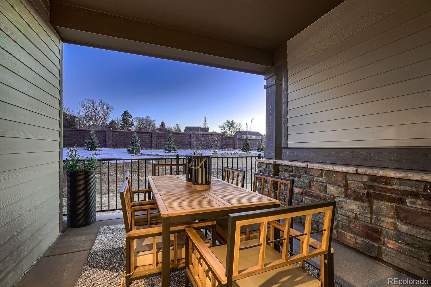 12880 Inca Street Westminster, CO 80234 - Photo 2 of 50 a balcony with table and chairs