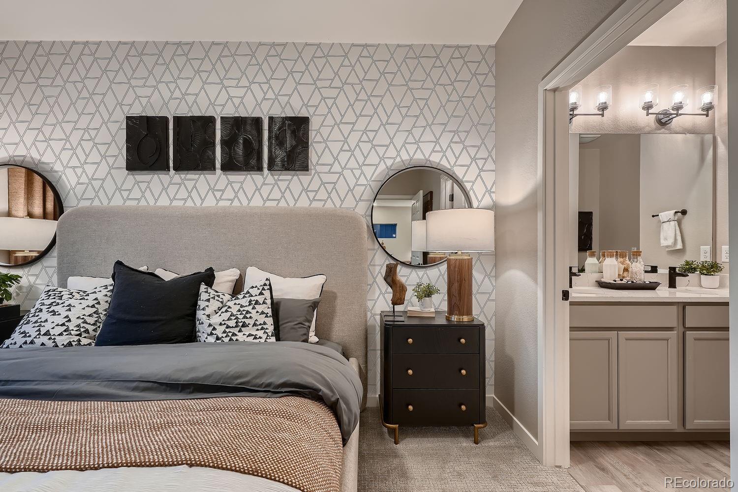 12880 Inca Street Westminster, CO 80234 - Photo 32 of 50 a bed room with a bed and a television