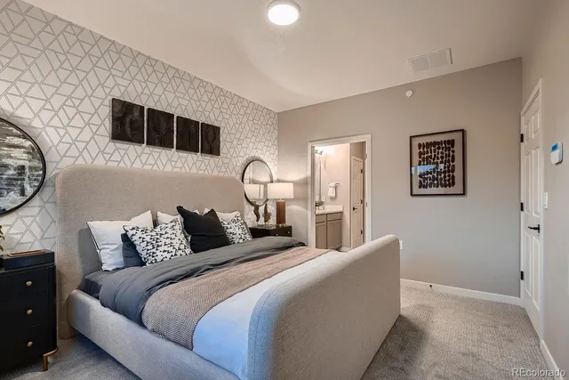 a bedroom with bed and a night stand