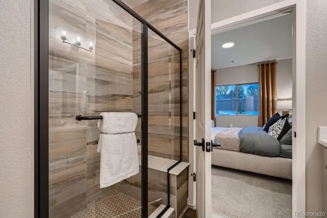 a bathroom with double vanity sinks a vanity and a mirror