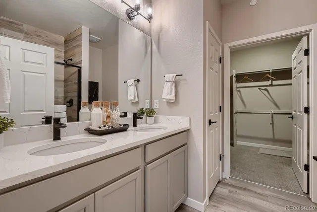 a view of a hallway and a livingroom with a chair