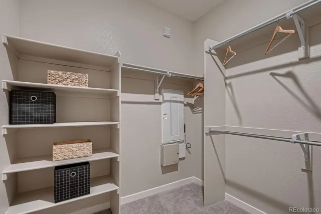 a bedroom with a bed and a table in it