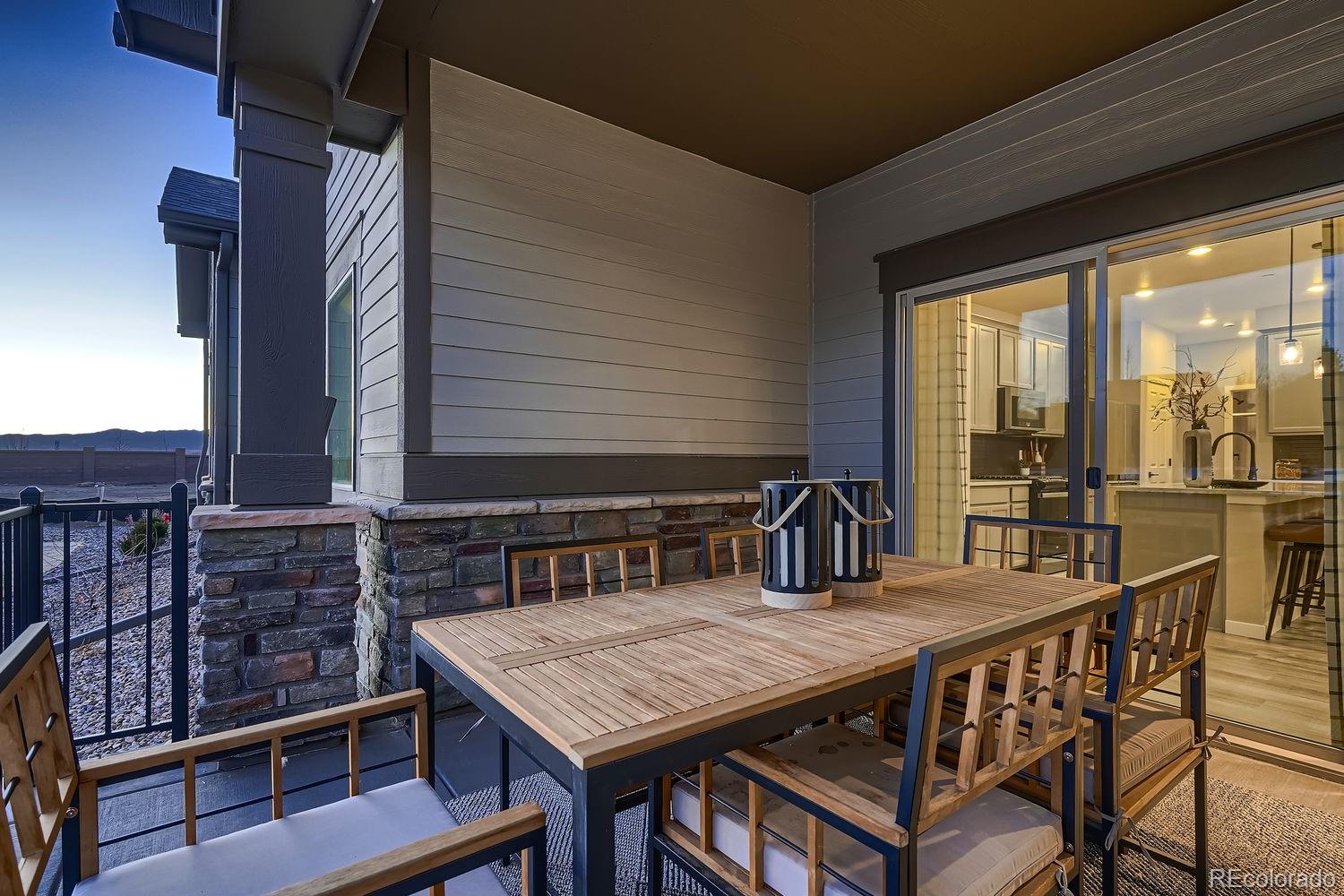 12880 Inca Street Westminster, CO 80234 - Photo 47 of 50 a view of a roof deck with table and chairs