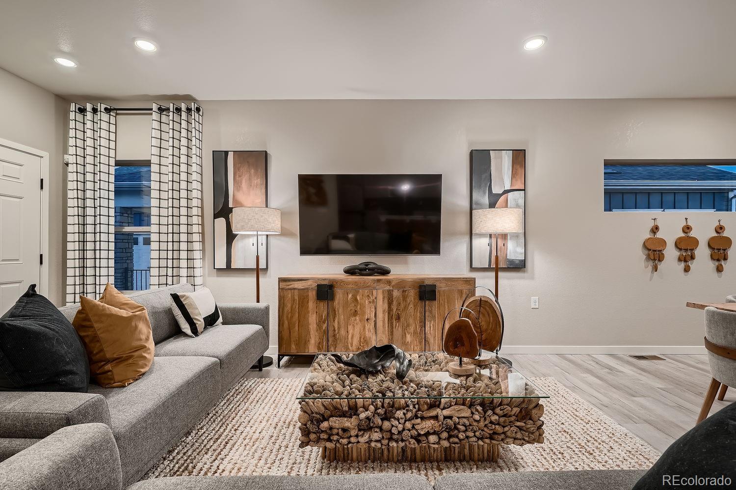 12880 Inca Street Westminster, CO 80234 - Photo 7 of 50 a living room with furniture and a flat screen tv