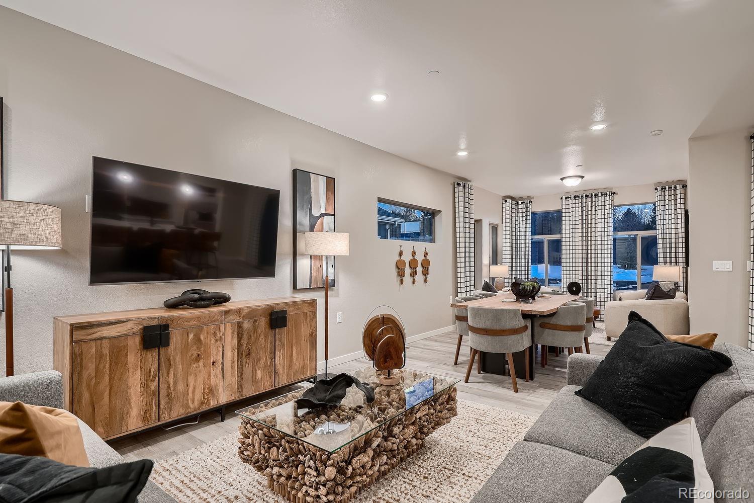12880 Inca Street Westminster, CO 80234 - Photo 8 of 50 a living room with furniture and a flat screen tv