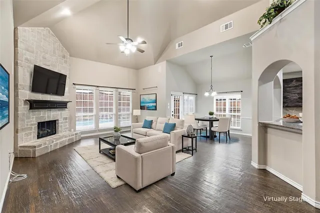 a living room with fireplace furniture and a flat screen tv