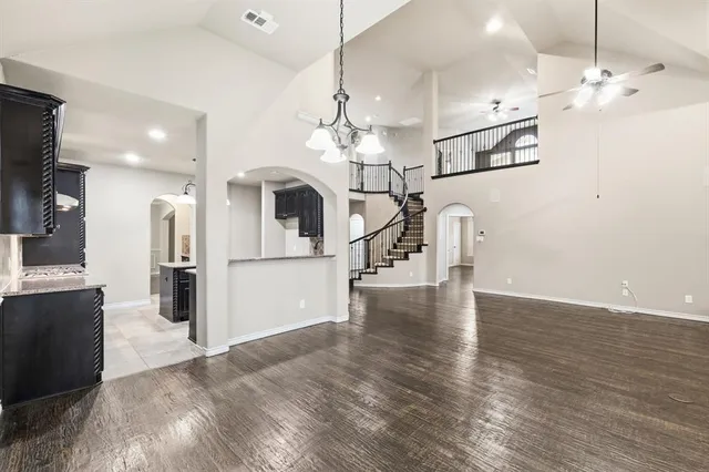 a view of a kitchen with a sink and refrigerator