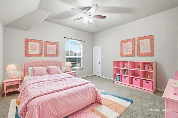 a bedroom with a bed furniture and a window