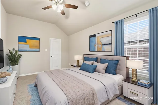 a bedroom with a bed and a window