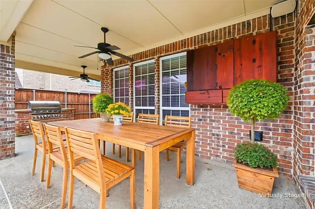a view of a chairs and table in the patio