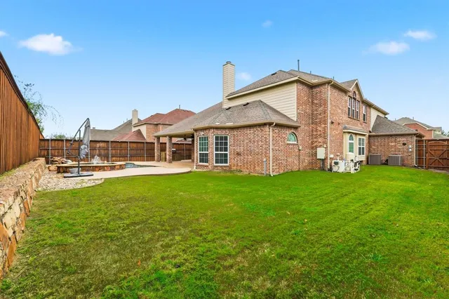 a view of a house with a yard porch and sitting area
