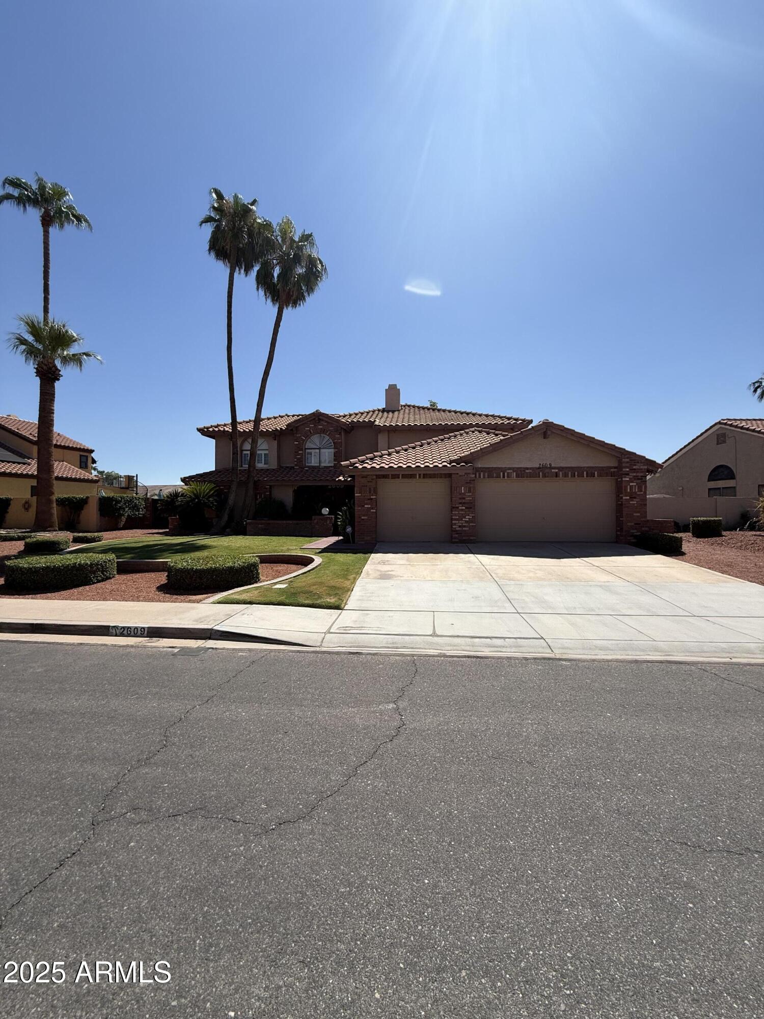 2609 West Upland Drive Chandler, AZ 85224 - Photo 1 of 1 a view of street with a car parked on the road