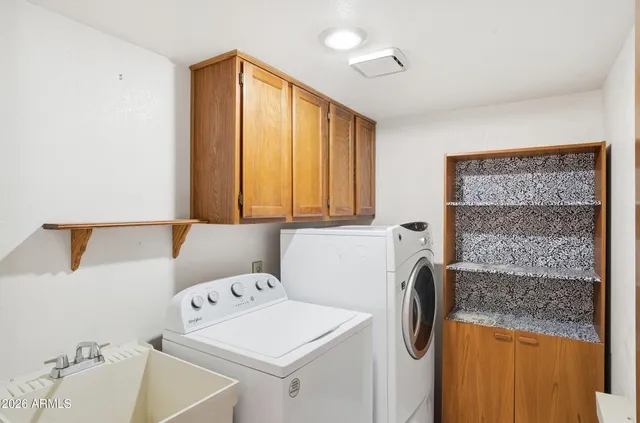 a utility room with dryer and washer