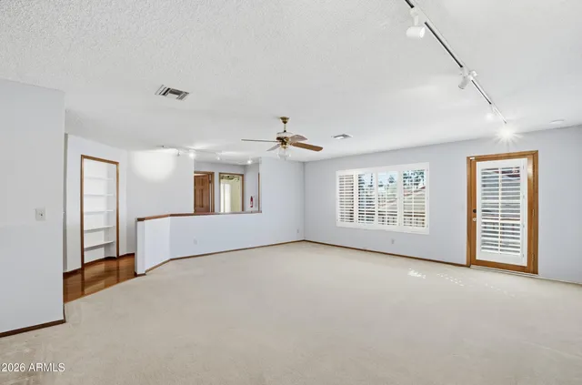 a view of empty room with windows