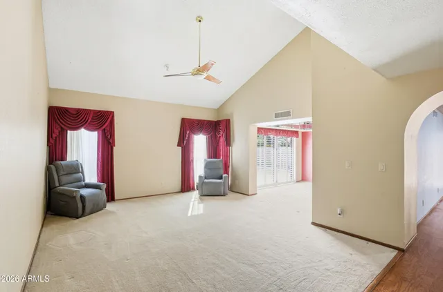 a view of a livingroom with furniture and windows