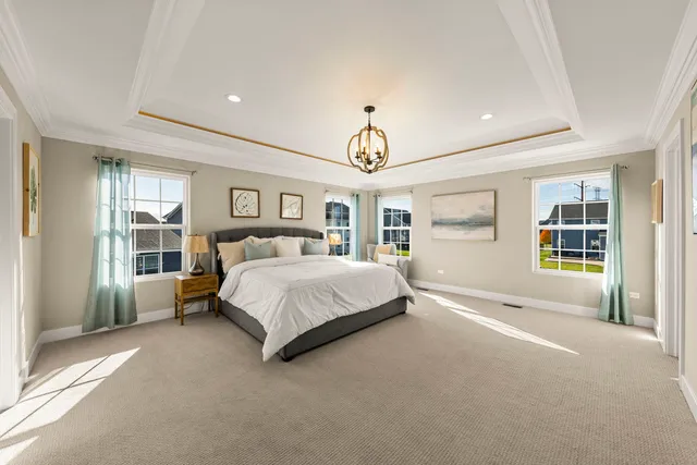 a spacious bedroom with a large bed and a window