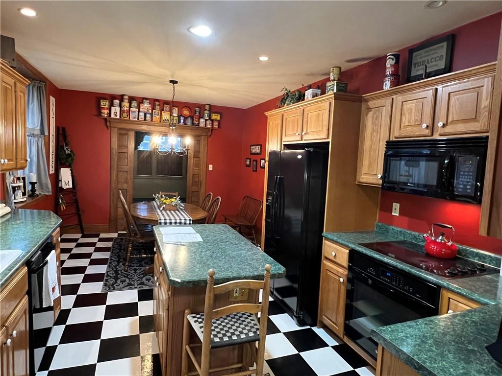 481 Heller Street Rochester, PA 15074 - Photo 5 of 24 a kitchen with granite countertop stainless steel appliances a sink and cabinets