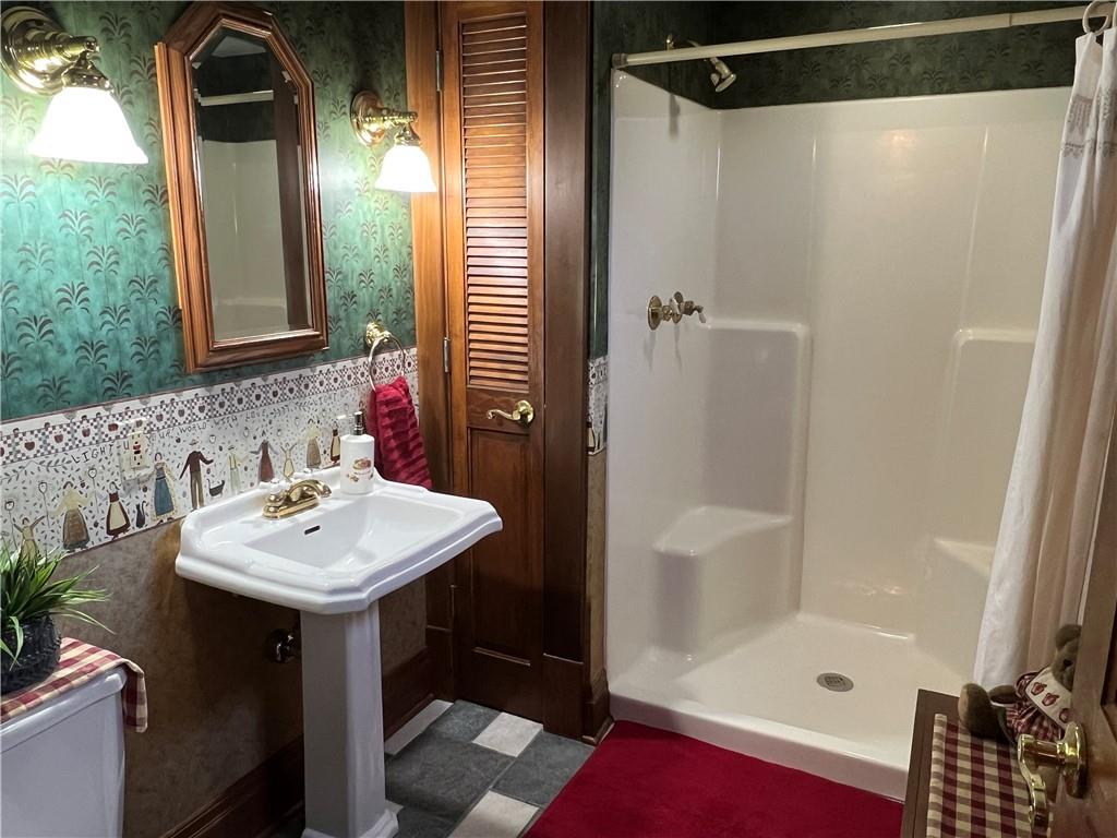 481 Heller Street Rochester, PA 15074 - Photo 10 of 24 a bathroom with a sink and a mirror
