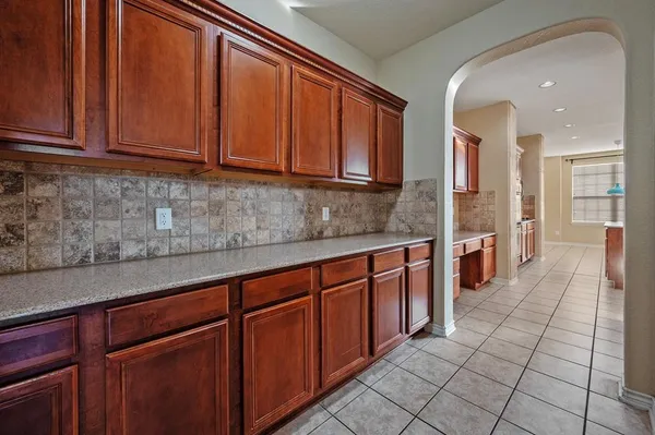 a kitchen with stainless steel appliances granite countertop a sink and cabinets