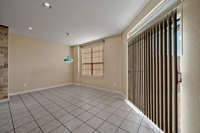 a view of a hallway with a dining area