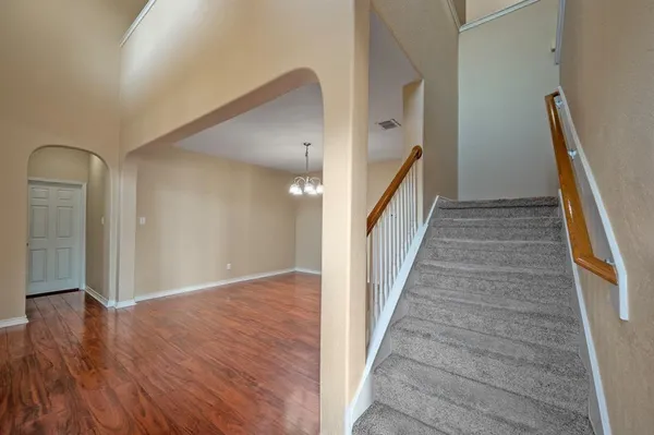 a bathroom with a double vanity sink mirror and toilet