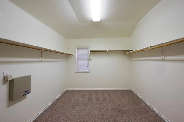a large bathroom with a double vanity sink and a mirror