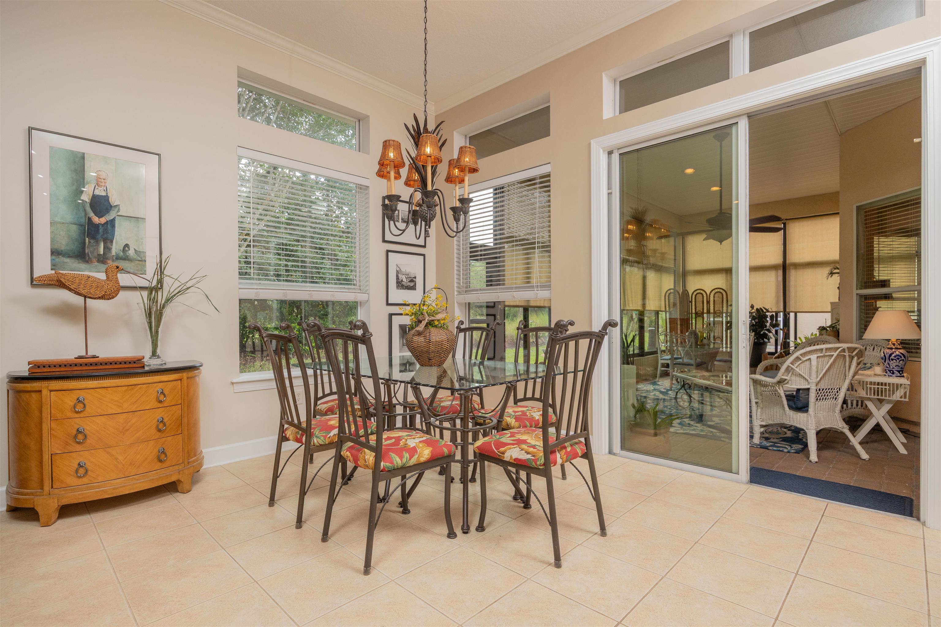 1160 Inverness Drive St. Augustine, FL 32092 - Photo 21 of 77 a view of a dining room with furniture and chandelier