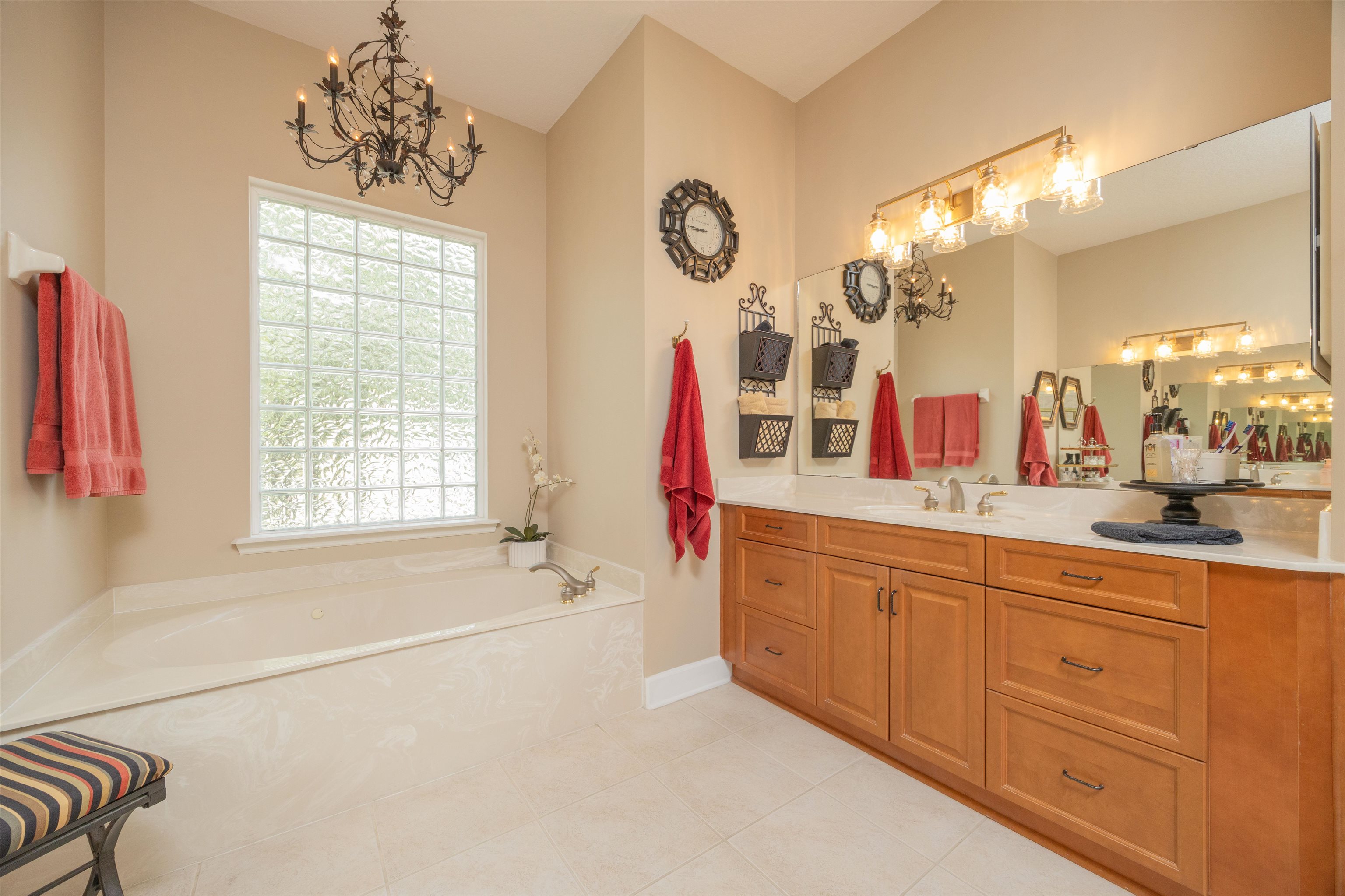 1160 Inverness Drive St. Augustine, FL 32092 - Photo 40 of 77 a spacious bathroom with a sink mirror and a bathtub