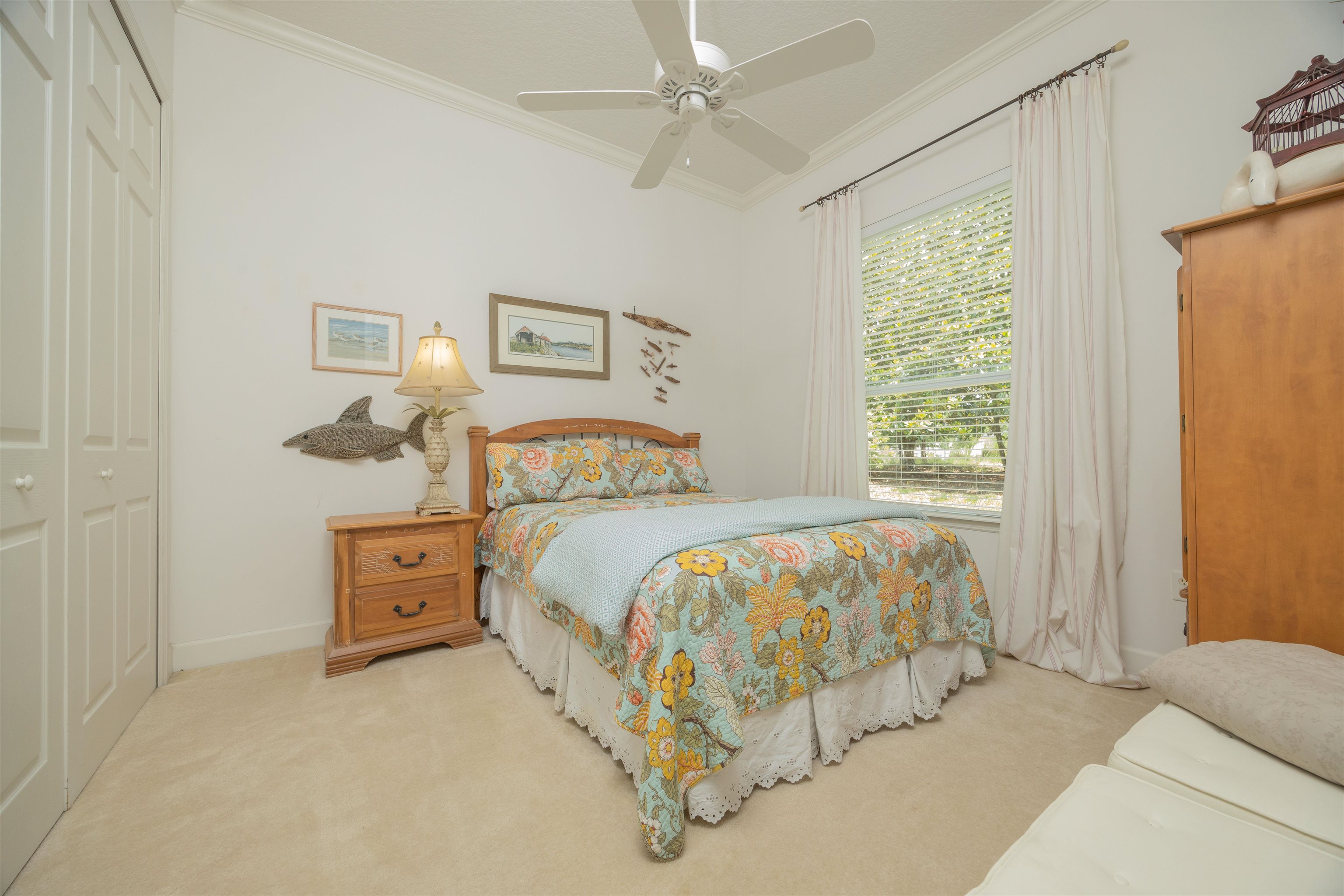 1160 Inverness Drive St. Augustine, FL 32092 - Photo 43 of 77 a bedroom with a bed and window