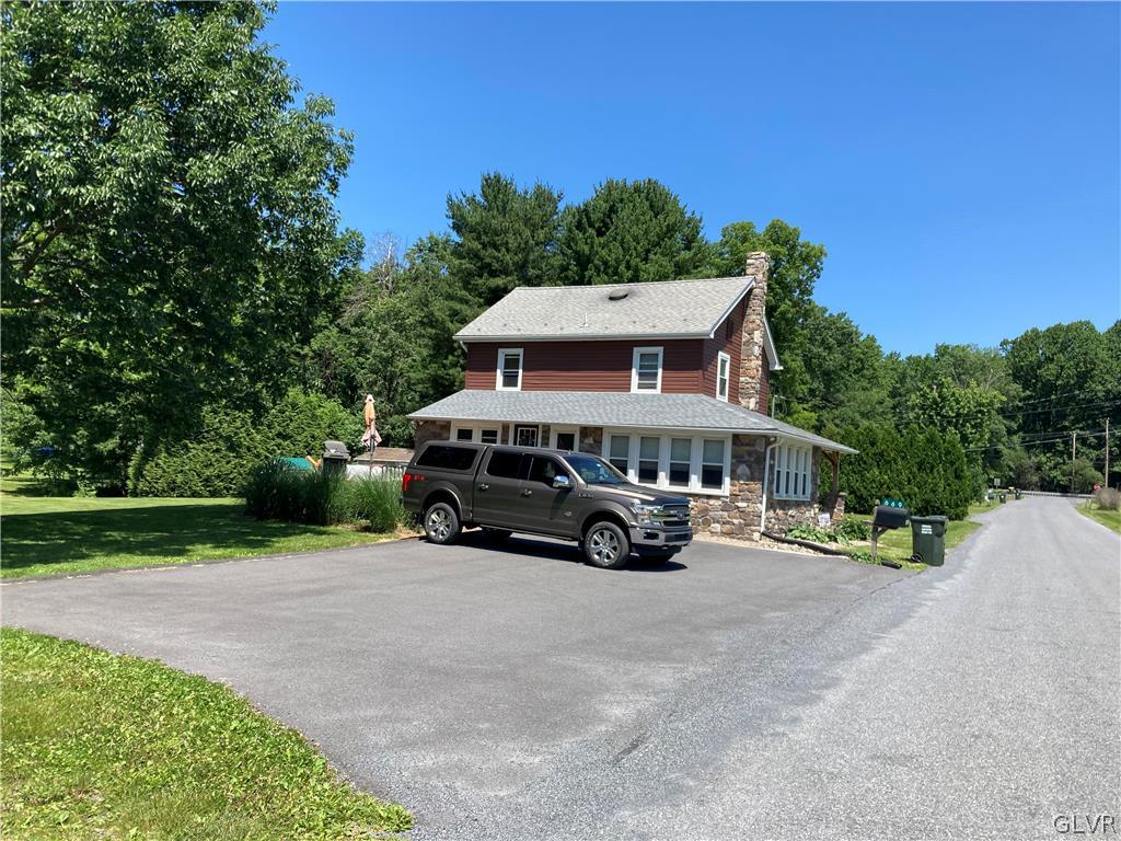 669 South Summit Road Bath, PA 18014 - Photo 3 of 50 a view of a car is parked in front of the house