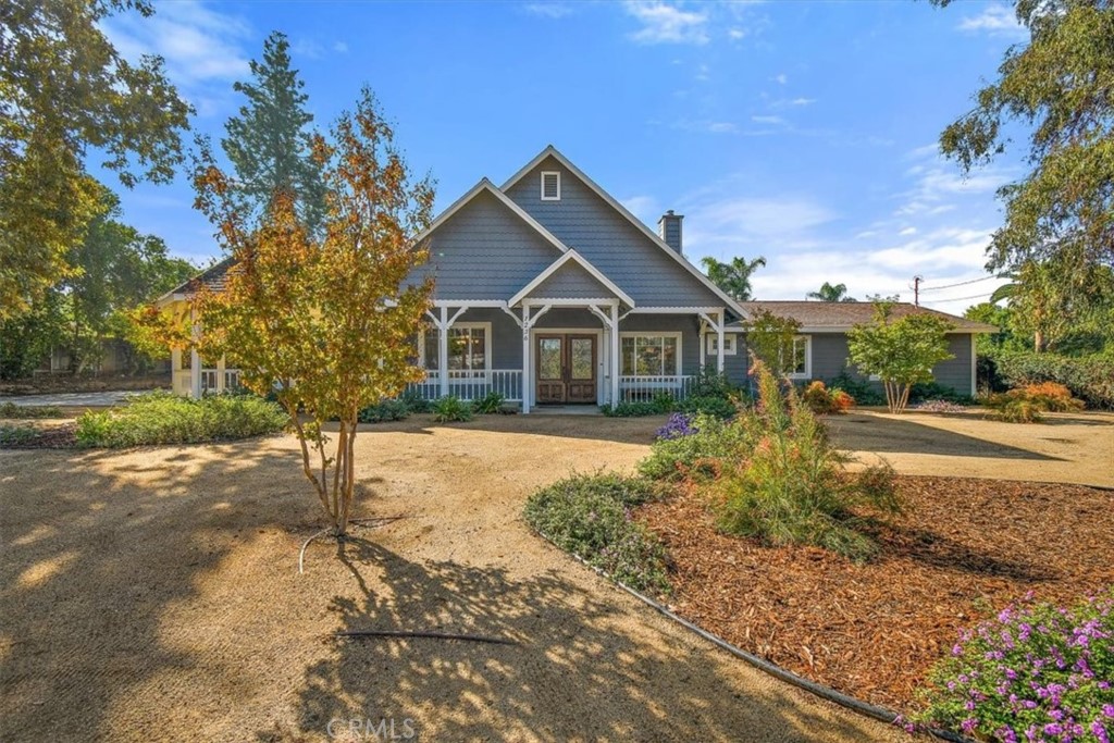 1236 Bradley Street Riverside, CA 92506 - Photo 1 of 1 a front view of house with yard and trees around