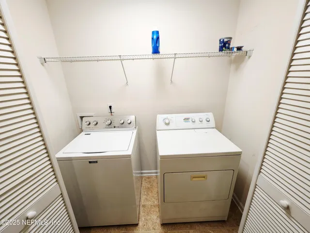 a view of an empty room with windows