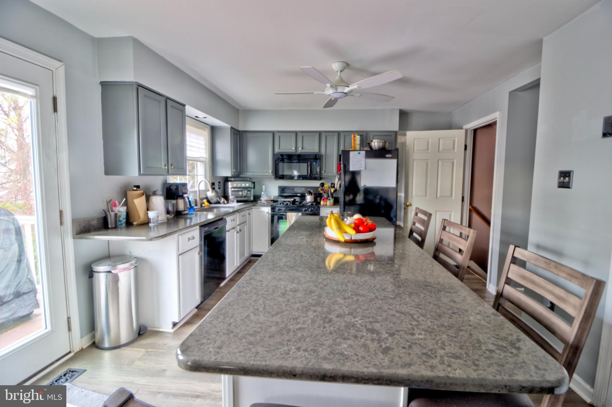 3879 Schroeder Avenue Perry Hall, MD 21128 - Photo 12 of 31 a living room with stainless steel appliances granite countertop a refrigerator stove top oven and sink