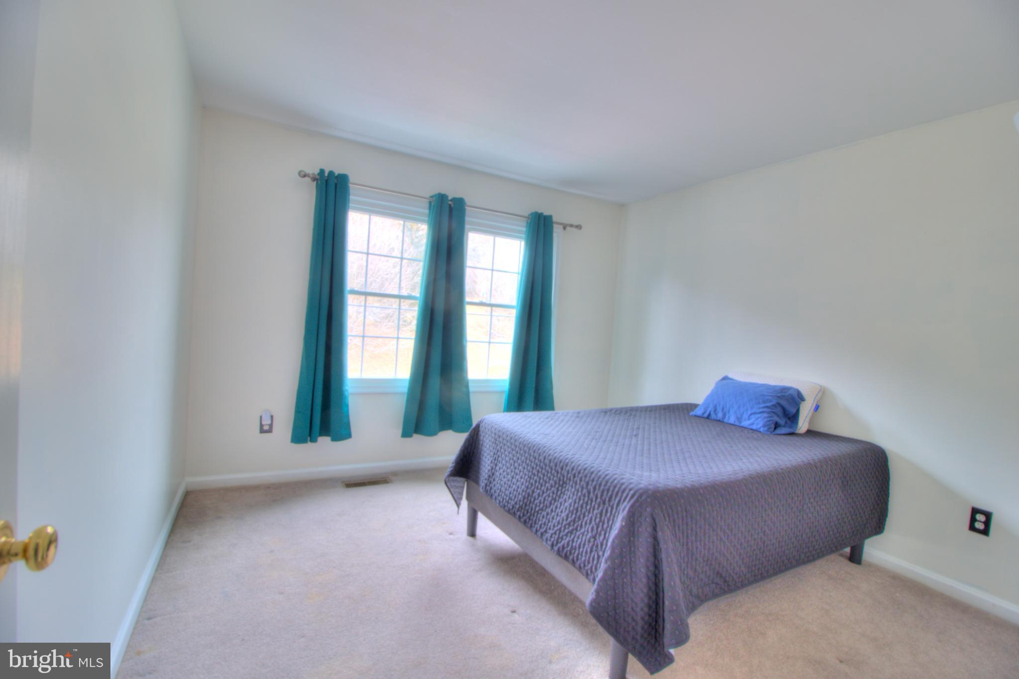 3879 Schroeder Avenue Perry Hall, MD 21128 - Photo 24 of 31 a bedroom with a bed and window