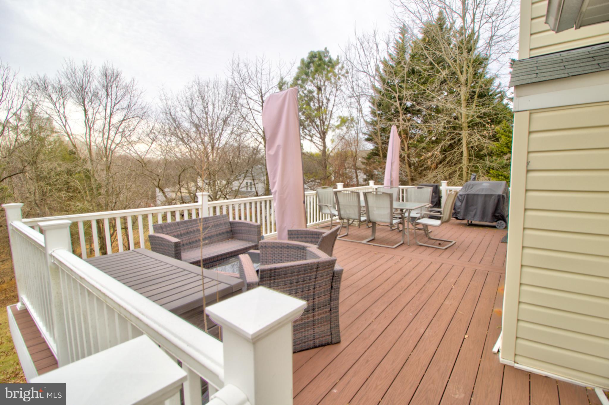 3879 Schroeder Avenue Perry Hall, MD 21128 - Photo 6 of 31 a view of balcony with wooden floor and outdoor seating