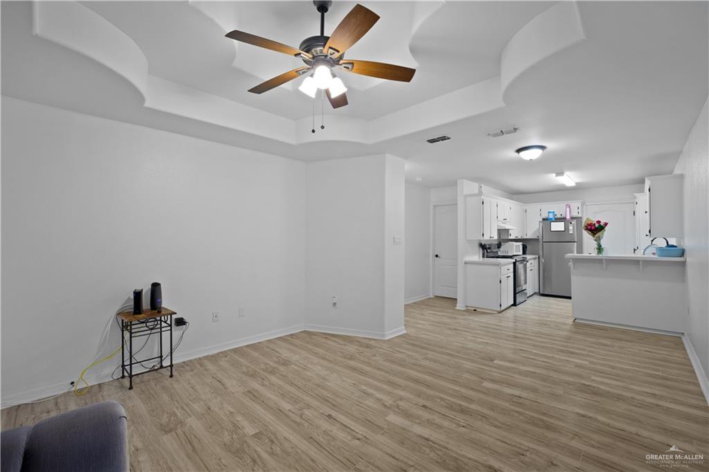 159 North Bridge Avenue Weslaco, TX 78596 - Photo 2 of 19 a view of kitchen with wooden floor and a sink