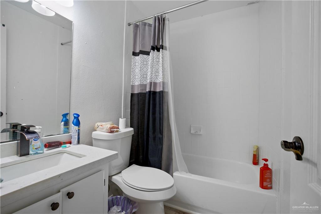159 North Bridge Avenue Weslaco, TX 78596 - Photo 6 of 19 a bathroom with a sink toilet and shower
