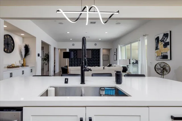 a kitchen with a stove and a sink