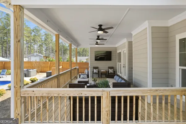 a view of a porch and wooden floor