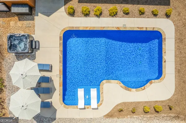 a bathroom with a tub and toilet