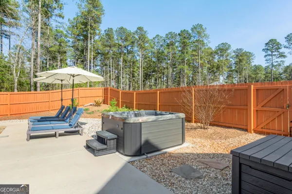 a view of a backyard with sitting area