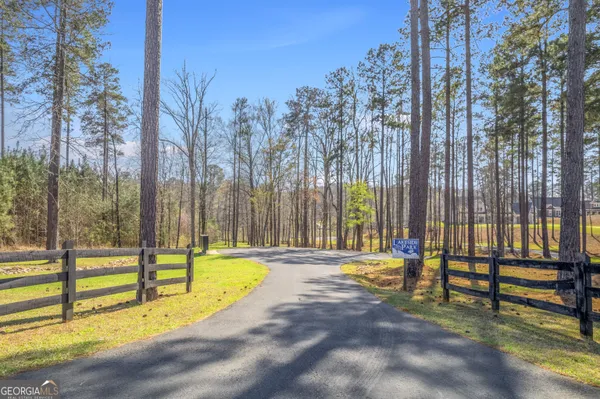 a view of park with iron fence