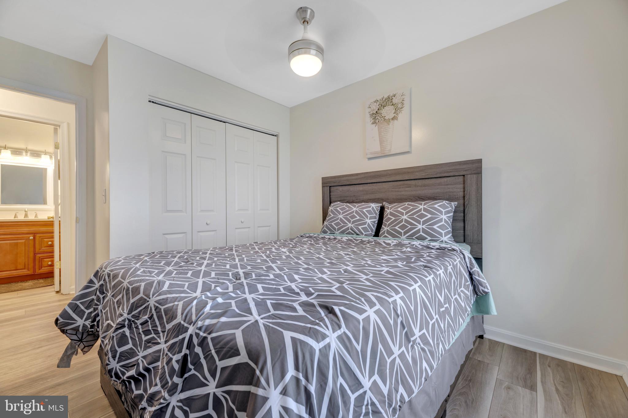 7108 Ruthgreen Road Windsor Mill, MD 21244 - Photo 5 of 25 a bedroom with a bed and a window