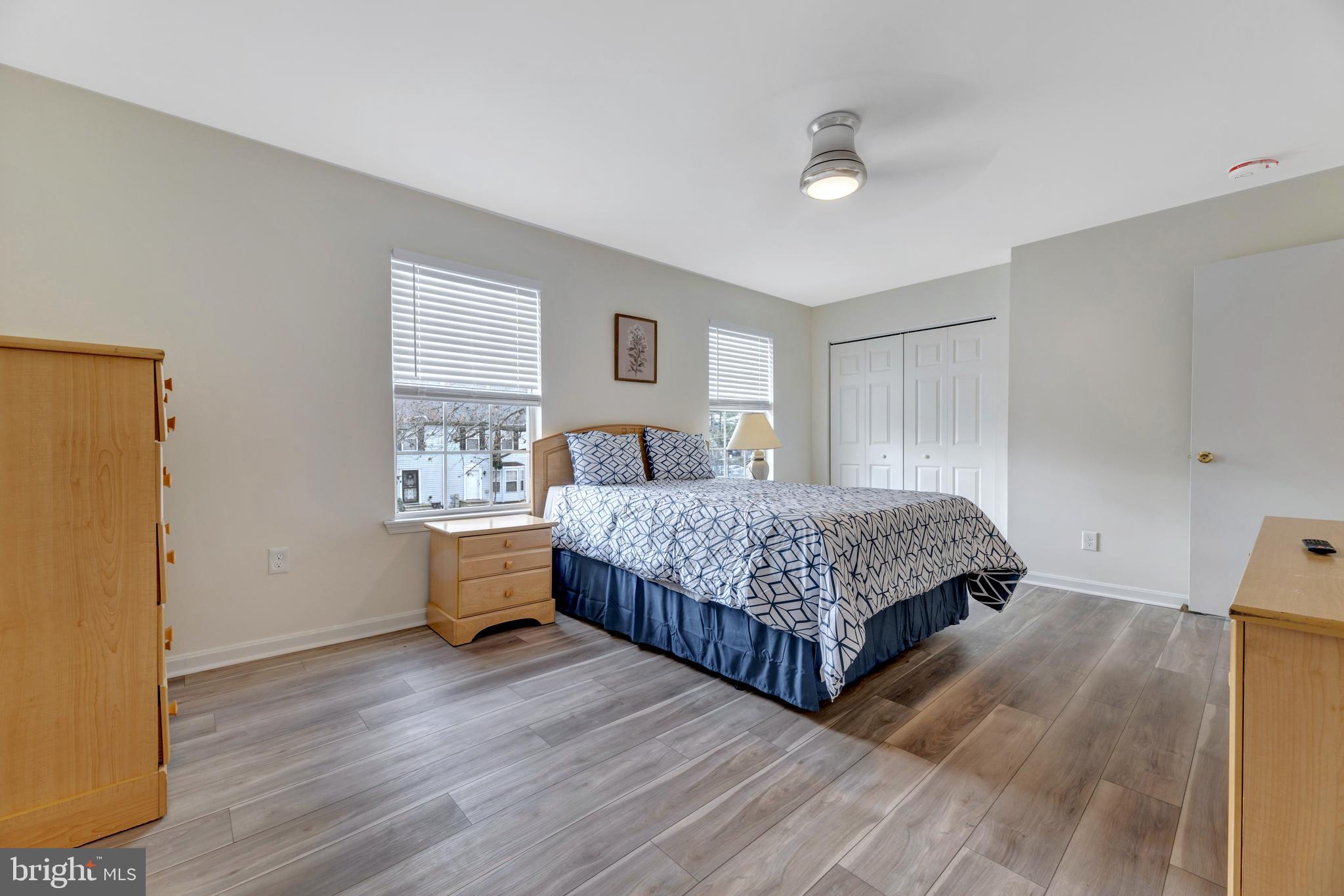 7108 Ruthgreen Road Windsor Mill, MD 21244 - Photo 7 of 25 a bedroom with a bed and wooden floor
